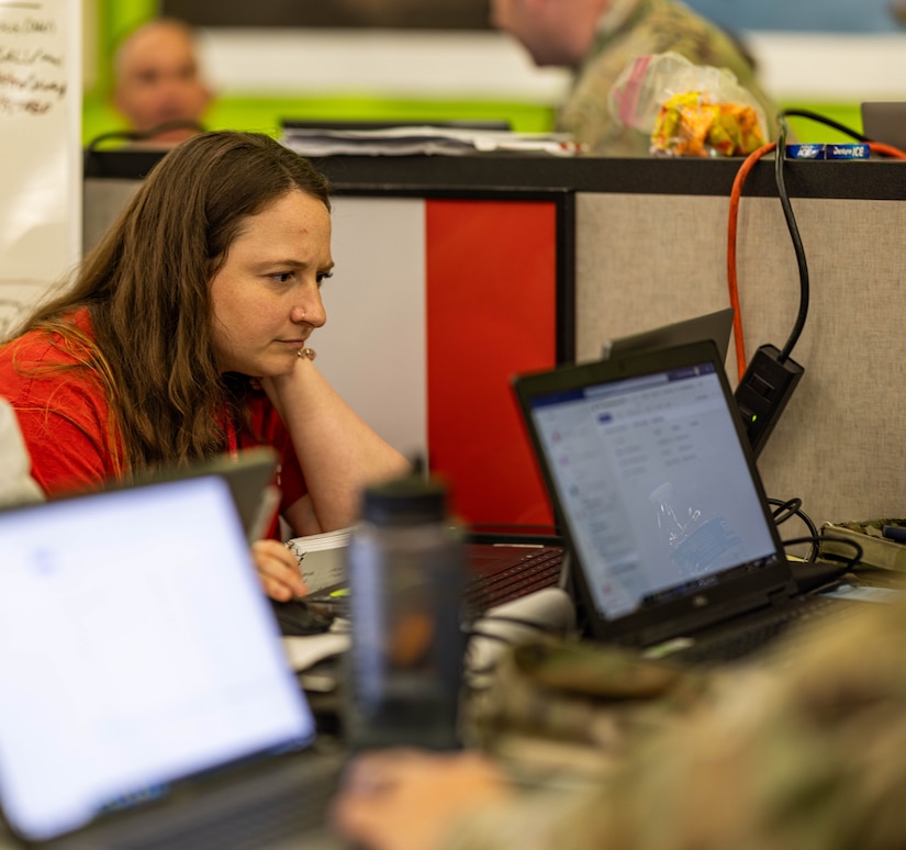 During an emergency, an operations liaison, like U.S. Army Corps of Engineers, Baltimore District biologist Ariel Poirier pictured here during the Key Bridge Response in April 2024, plays a critical role in ensuring effective communication, coordination, and decision-making among the various agencies, departments, and teams involved in the response efforts. Their primary goal is to support the Emergency Operations Center (EOC) in managing the crisis and minimizing its impact on the community. (U.S. Army photo by David Adams)