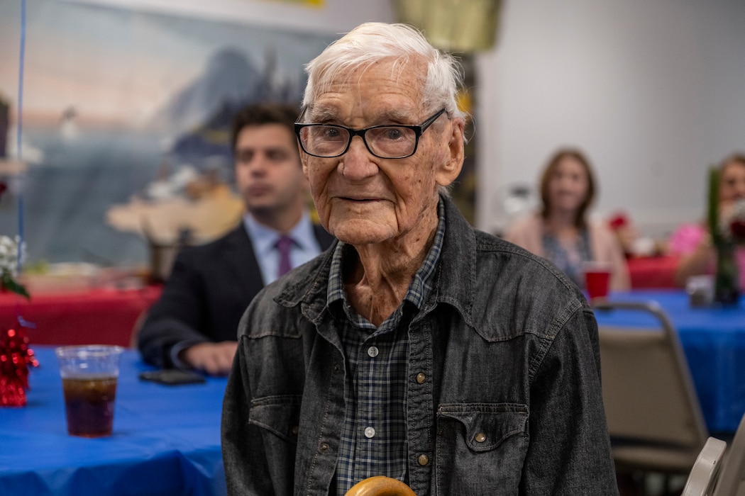 James Herring, a retired U.S. Air Force chief master sergeant and WWII veteran, poses for a photo