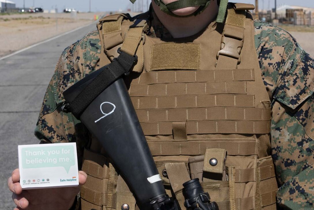 A Marine at the Marine Corps Logistics Base Barstow holding a pad that says "Thank you for believing me." The pad also has the Department of Defense's Safe Helpline contact info.



This was in support of Sexual Assault Awareness and Prevention Month.