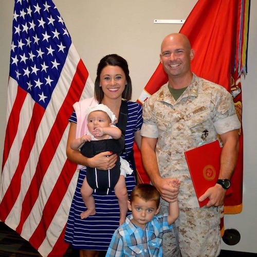 U.S. Marine Corps Major Thomas Coyle stands with Felicia Coyle, his wife; Macie Coyle, his daughter; and Brody Coyle, his son. (Courtesy Photo)