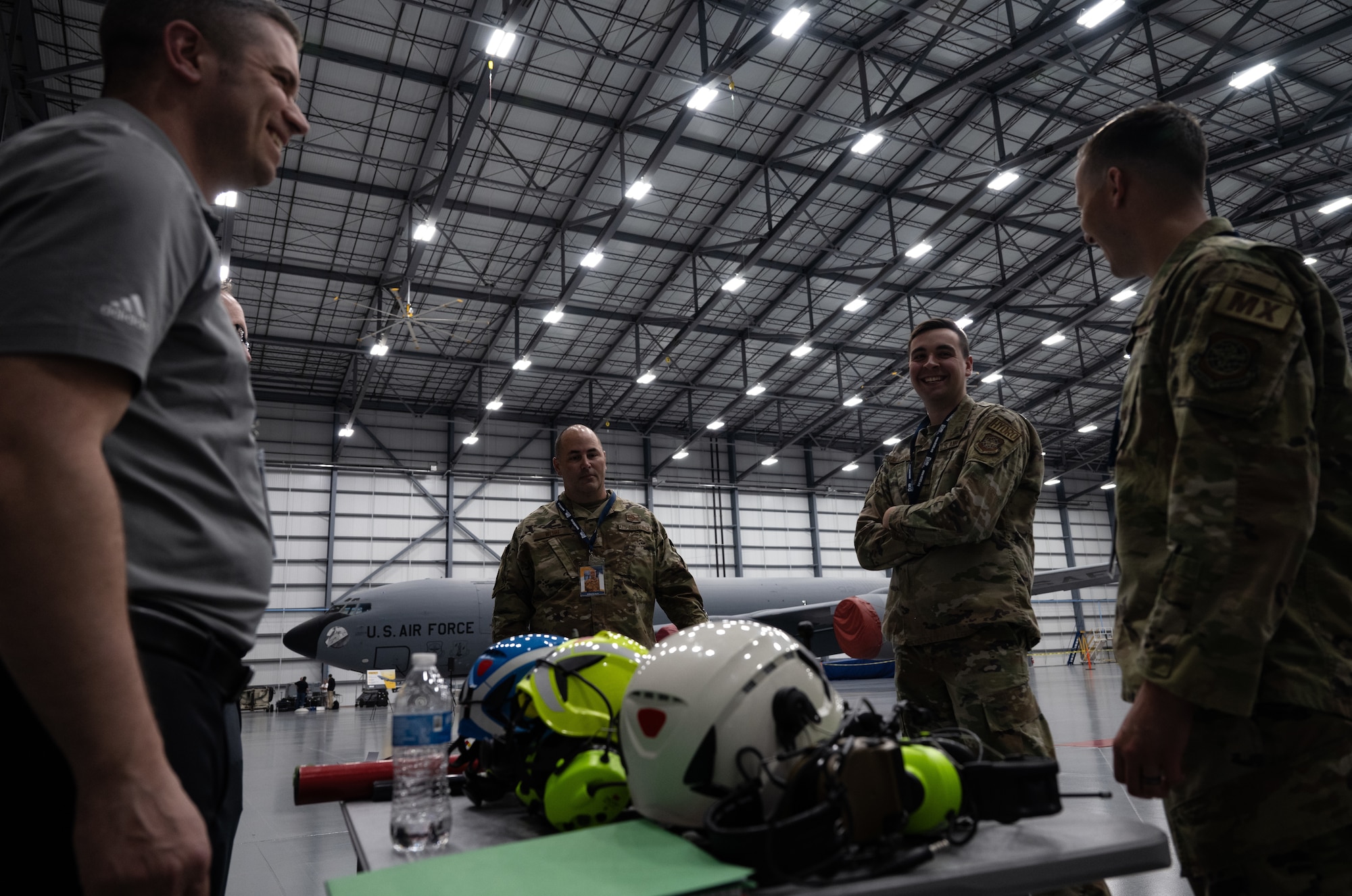 Airmen and industry partners discuss safety equipment during STRATO-Tech, a convention to sustain the KC-135 Stratotanker, on April 23, 2024, in Wichita, Kansas. Air Mobility Command, the National Center for Manufacturing Sciences, Wichita State University’s National Institute for Aviation Research, and U.S. Transportation Command partnered to create an innovative testbed that keeps the KC-135 relevant and fit to fight. (U.S. Air Force photo by Staff Sgt. Tryphena Mayhugh)