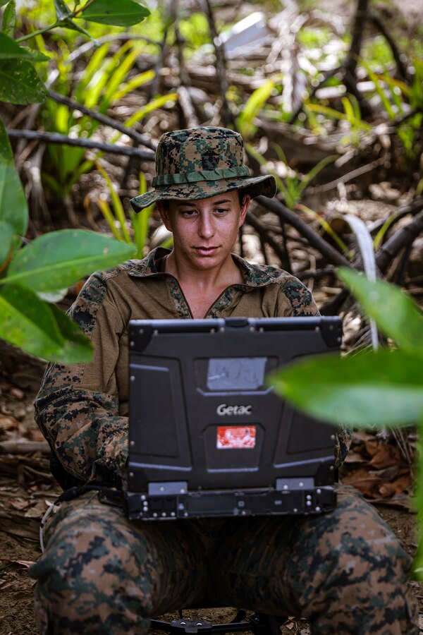 U.S. Marine Corps 1st Lt. Kaylee Mackenzie, left, a platoon commander assigned to Combat Logistics Battalion 15, 15th Marine Expeditionary Unit, establishes communications with the amphibious transport dock USS Somerset (LPD 25) during Exercise Balikatan 24 after offloading on Kemdeng Beach, San Vicente, Philippines, April 28, 2024. BK 24 is an annual exercise between the Armed Forces of the Philippines and the U.S. military designed to strengthen bilateral interoperability, capabilities, trust, and cooperation built over decades of shared experiences. (U.S. Marine Corps photo by Cpl. Aidan Hekker)