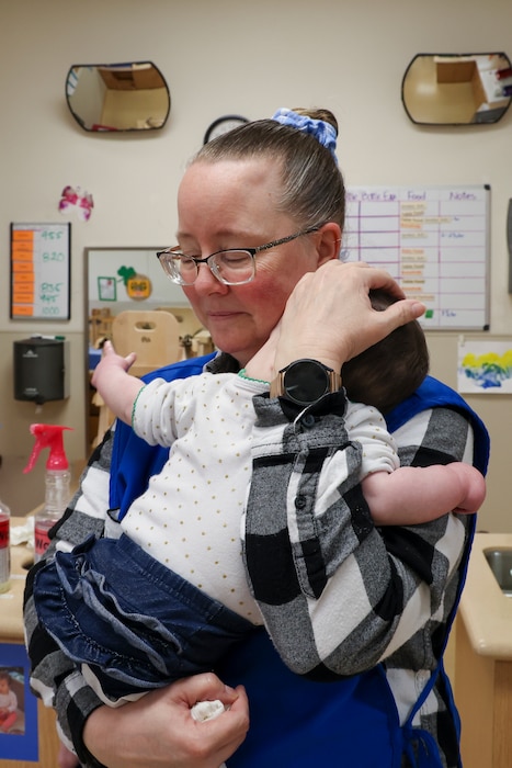 Debbie Kehishian, 9th Force Support Squadron Child Development Center (CDC) infant classroom lead teacher, cares for an infant in the CDC at Beale Air Force Base, California, March 14, 2024.