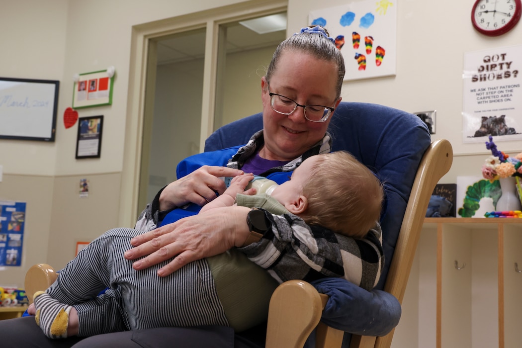 Debbie Kehishian, 9th Force Support Squadron Child Development Center (CDC) infant classroom lead teacher, feeds an infant in the CDC at Beale Air Force Base, California, March 14, 2024.