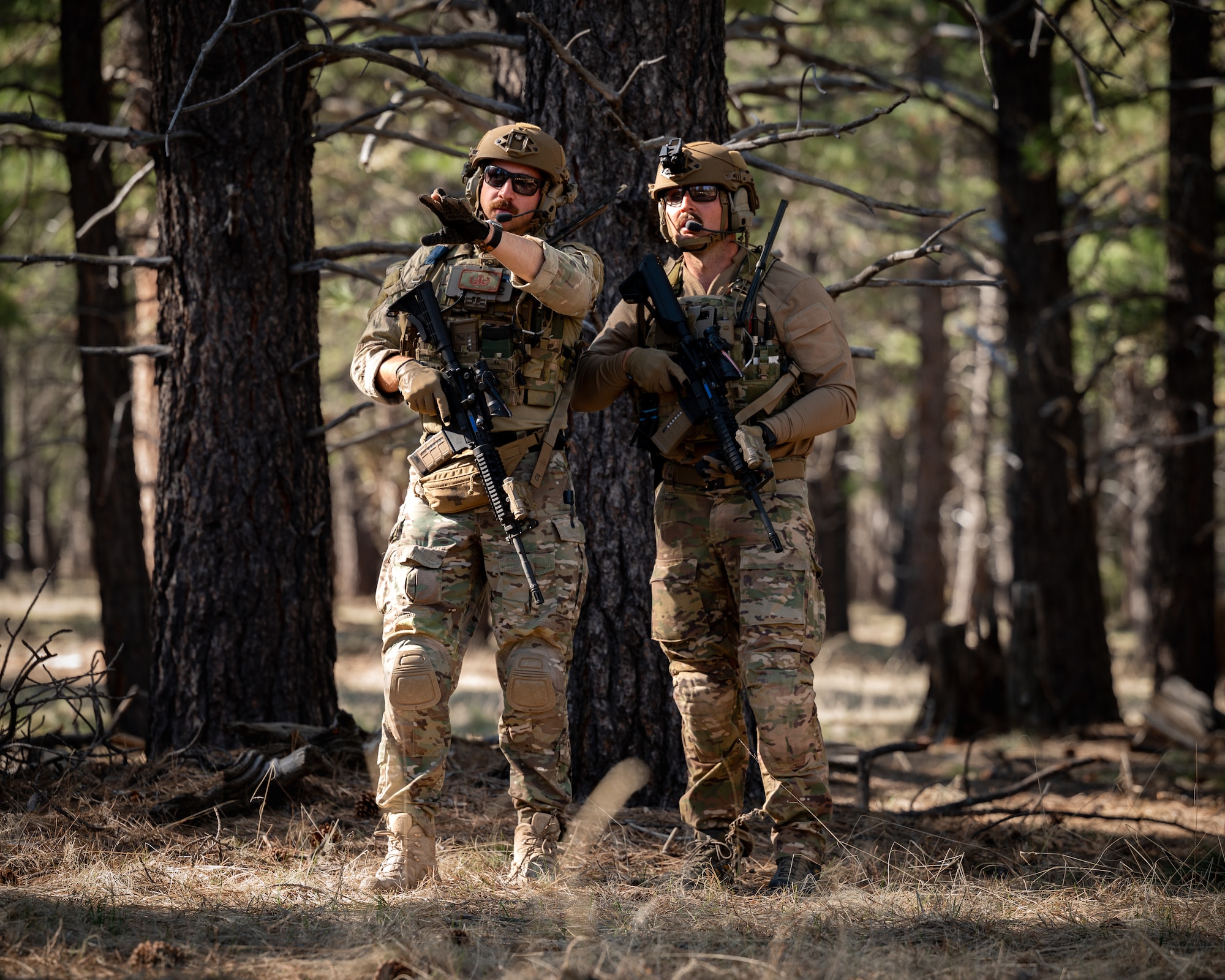 U.S. Air Force Senior Airman Seth Elroy (left) and Senior Airman Zachary Vincent (right), 56th Civil Engineer Squadron Explosive Ordnance Disposal technicians participate in an infiltration scenario during exercise Operation Pegasus at Camp Navajo, Arizona, April 21-26, 2024.