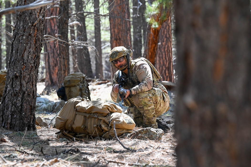U.S. Air Force Senior Airman Mark Turner, 56th Civil Engineer Squadron Explosive Ordnance Disposal technician, provides security watch over a rally point during exercise Operation Pegasus at Camp Navajo, Arizona, April 21-26, 2024.