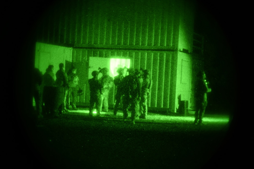 U.S. Air Force Airmen assigned to the 56th Civil Engineer Squadron Explosive Ordnance Disposal flight regroup after a night raid during exercise Operation Pegasus at Camp Navajo, Arizona, April 21-26, 2024.