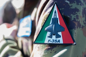 A custom patch sits on the sleeve of an Italian Air Force uniform.