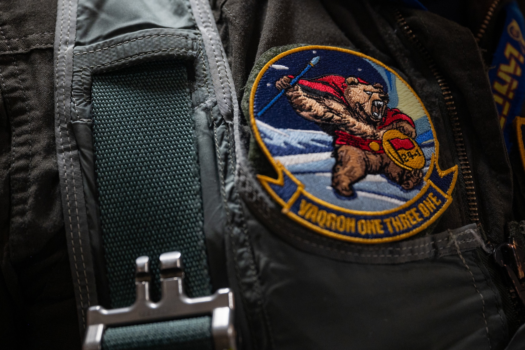 A custom patch sits on a service members uniform.