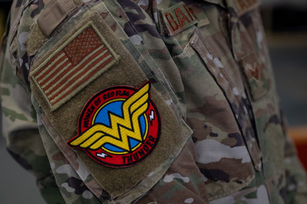 A custom patch sits on the sleeve of a service members uniform.