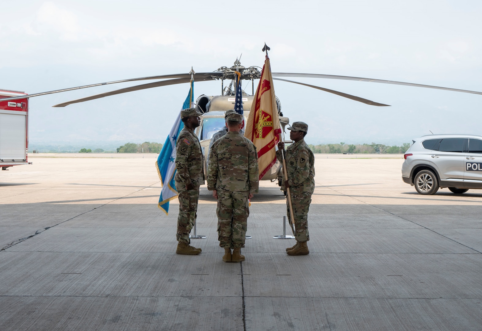 A photo of service members passing the colors.