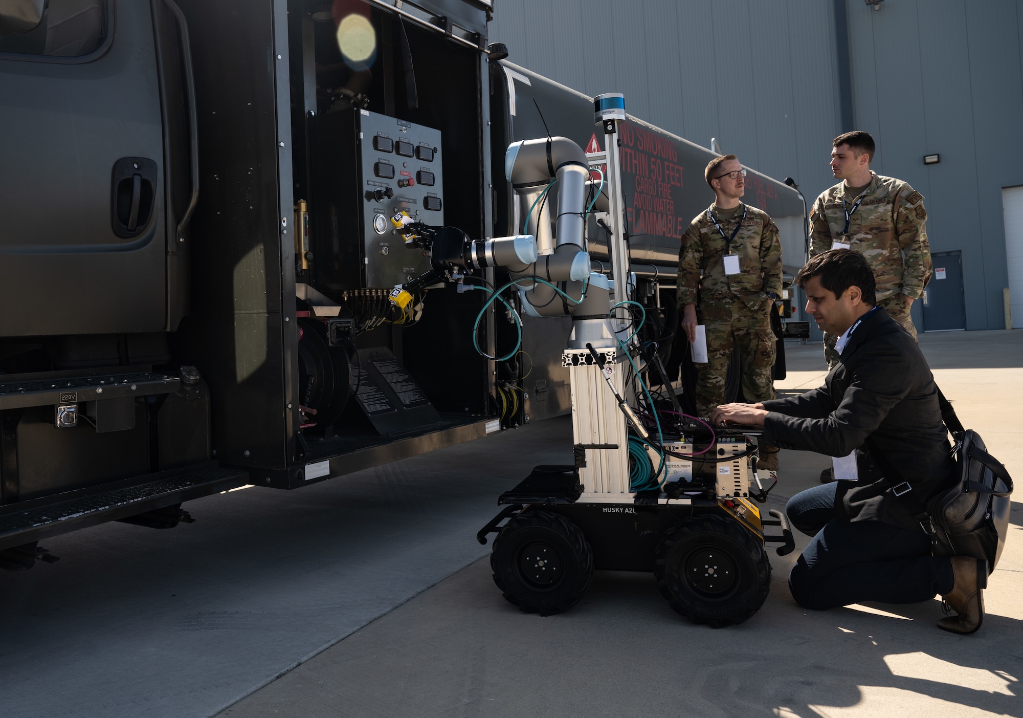 Shashwat Srivastav, Aivot chief executive officer, updates the software for his company’s robot to work on a fuel truck during STRATO-Tech, a convention for the sustainment of the KC-135 Stratotanker, April 22, 2024, in Wichita, Kansas. STRATO-Tech is an initiative under the Sustainment Technologies, Research and Automation for Transformative Operations Testbed that studies, develops and tests innovations to improve the efficiency and cost-effectiveness of the KC-135. (U.S. Air Force photo by Staff Sgt. Tryphena Mayhugh)