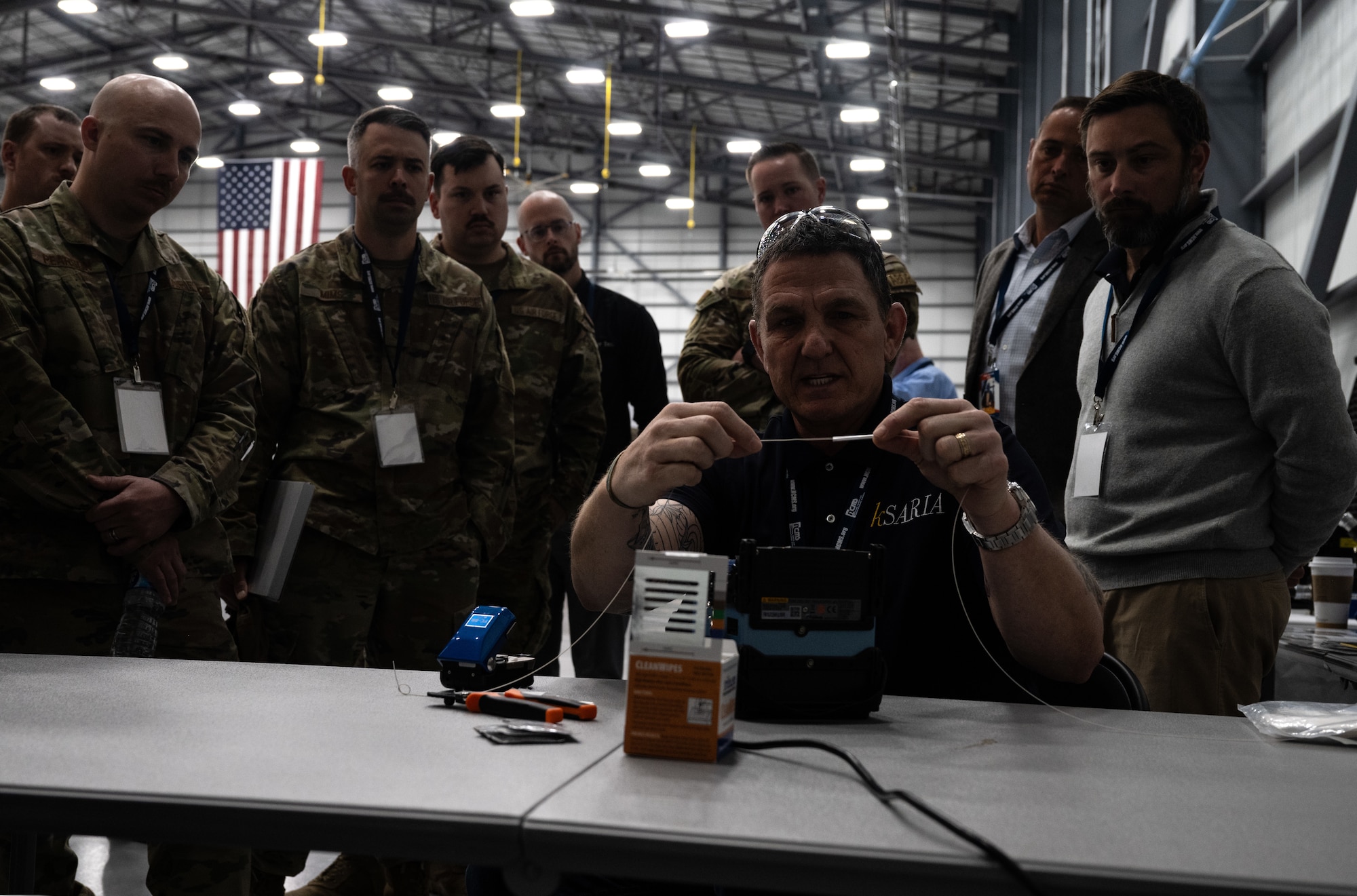 Richard Timberlake, kSARIA west coast training manager, demonstrates repairing fiber optic cables using his company’s technology during STRATO-Tech, a convention for the sustainment of the KC-135 Stratotanker, April 24, 2024, in Wichita, Kansas. STRATO-Tech aims to bring the U.S. Air Force together with outside agencies to collaborate on innovative technology for the KC-135. (U.S. Air Force photo by Staff Sgt. Tryphena Mayhugh)
