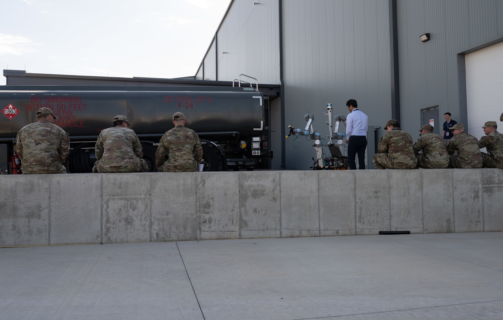 Shashwat Srivastav, Aivot chief executive officer, prepares to demonstrate his company’s robot working on a fuel truck during STRATO-Tech, a convention for the sustainment of the KC-135 Stratotanker, April 24, 2024, in Wichita, Kansas. STRATO-Tech is an initiative under the Sustainment Technologies, Research and Automation for Transformative Operations Testbed that studies, develops and tests innovations to improve the efficiency and cost-effectiveness of the KC-135.  (U.S. Air Force photo by Staff Sgt. Tryphena Mayhugh)