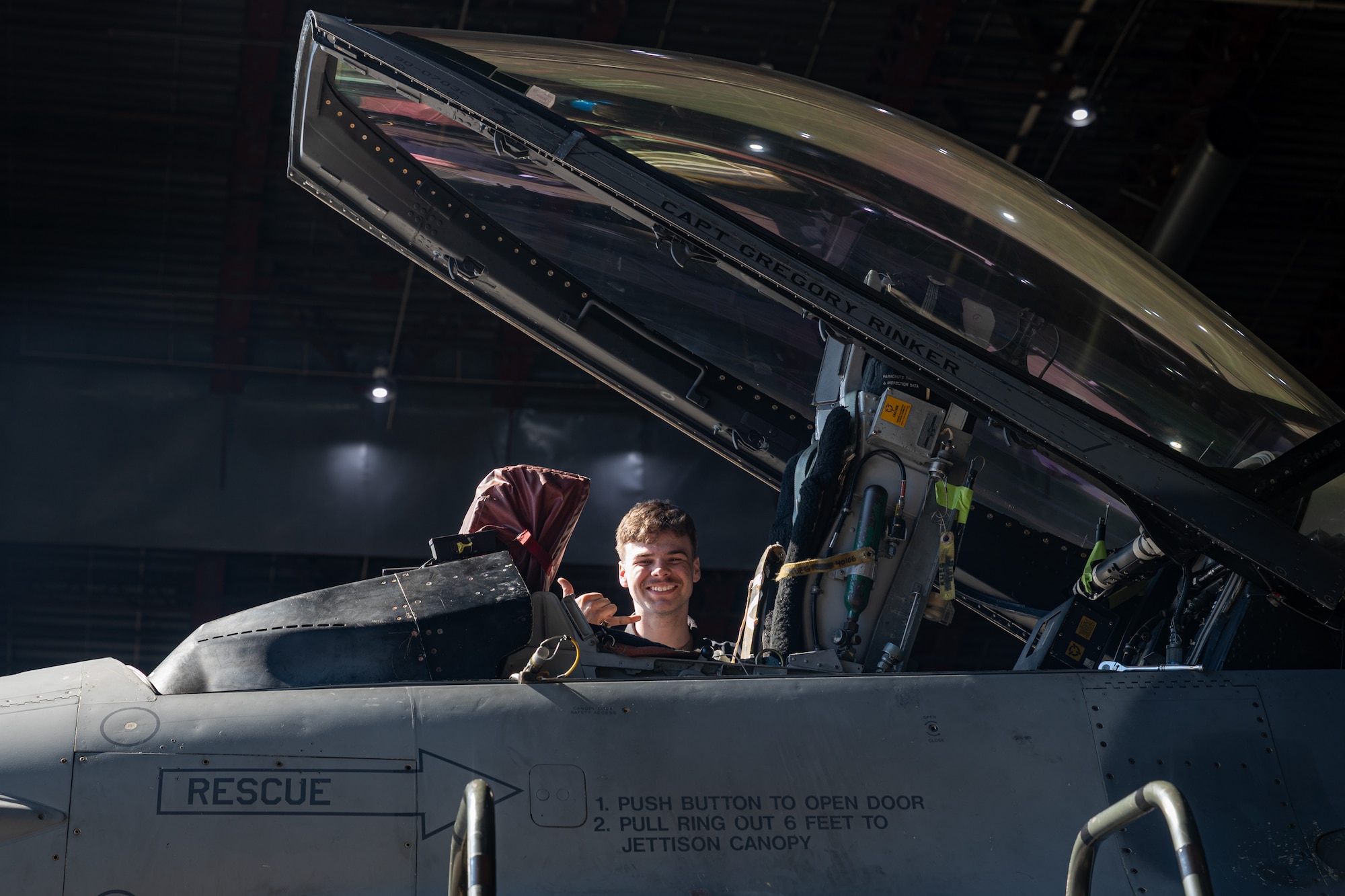 A service member poses for a photo.