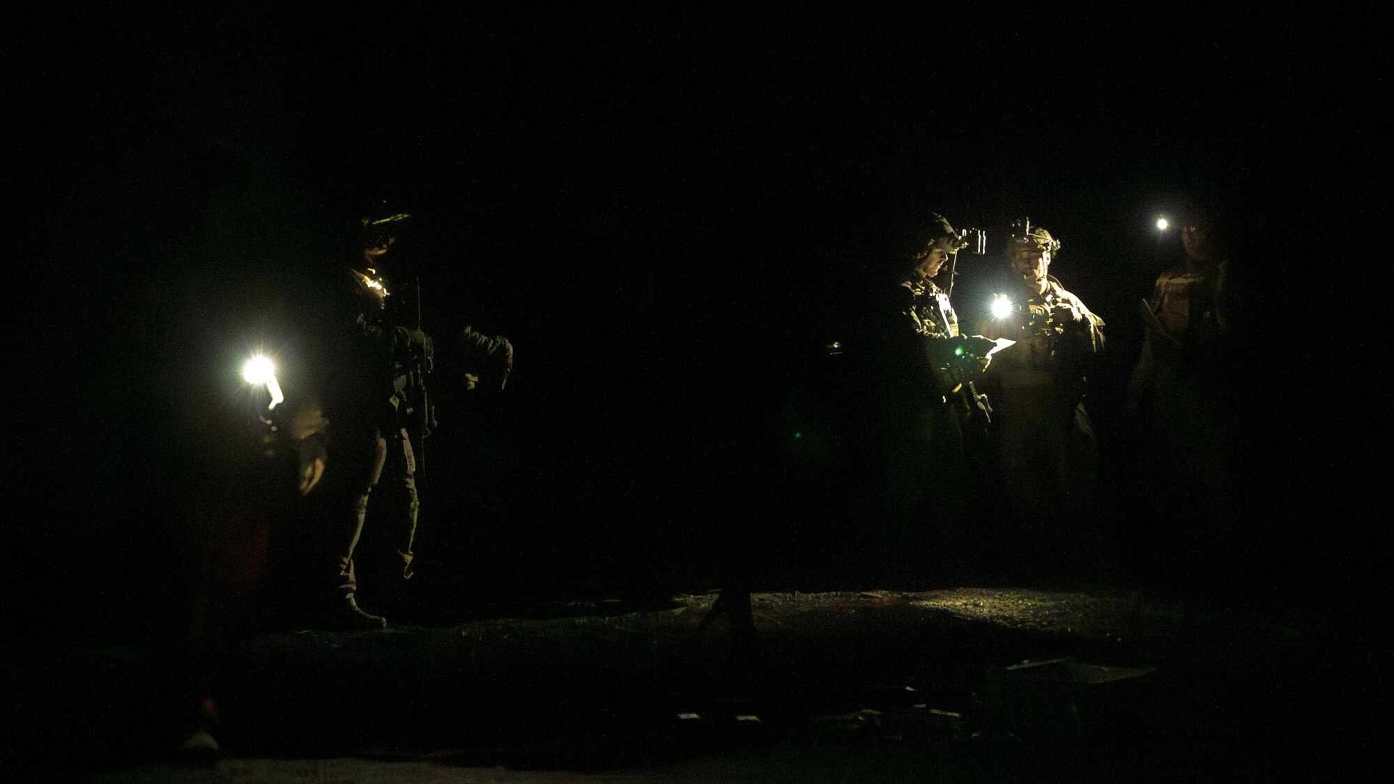 U.S. Air Force Airmen assigned to the 56th Civil Engineer Squadron Explosive Ordnance Disposal flight participate in a night infiltration scenario during exercise Operation Pegasus at Camp Navajo, Arizona, April 21-26, 2024.