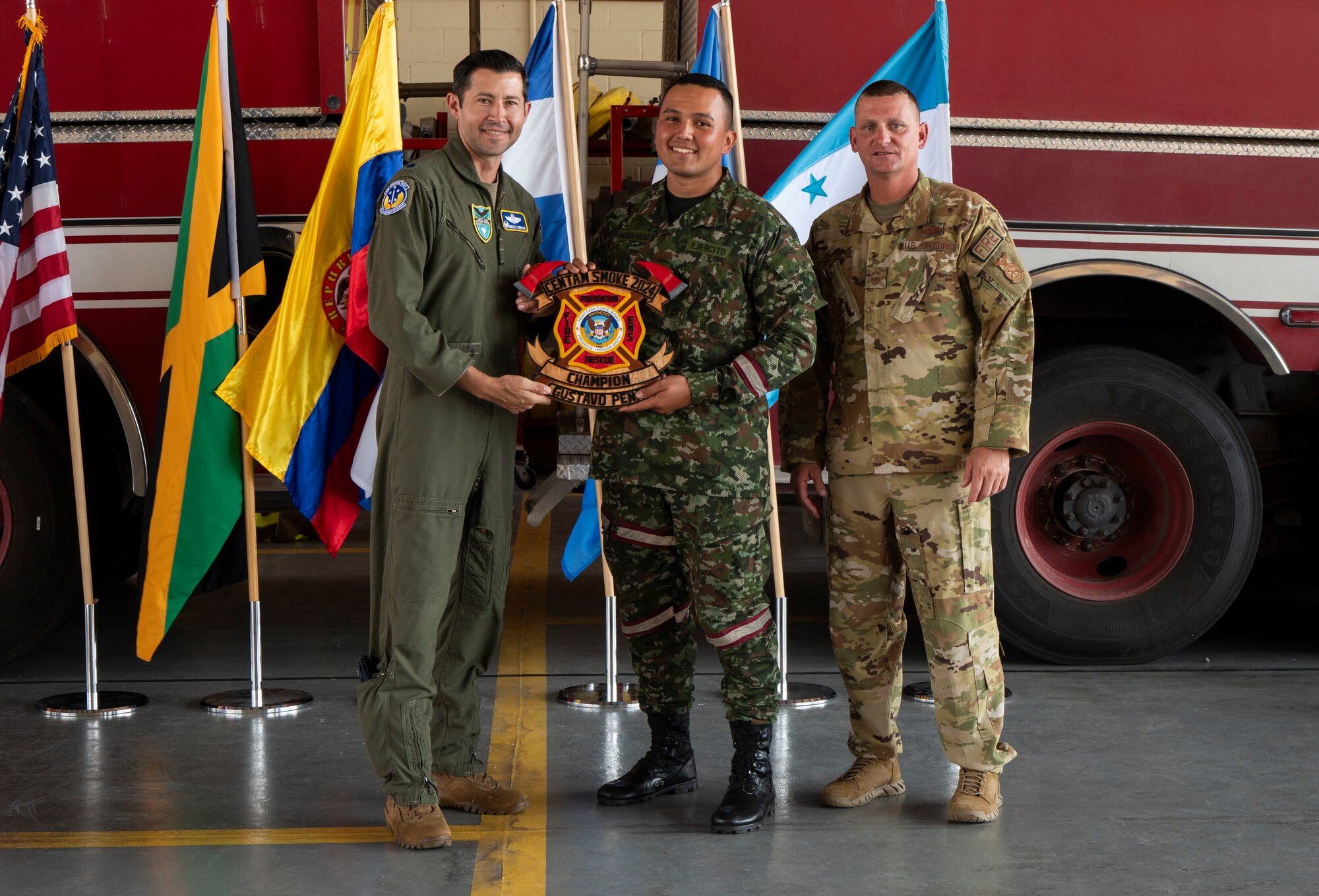 Gustavo Pena, a Colombian firefighter receives the “Top Performer” Award for the Firefighter Challenge Obstacle Course at the CENTAM SMOKE Closing Ceremony at Soto Cano Air Base, Honduras April 26, 2024. He completed the course in two minutes and 19 seconds, which consisted of techniques and procedures on hose advancements up two stories, nozzle control, vehicle extrication, rescue operations and carrying a 150-pound mannequin.