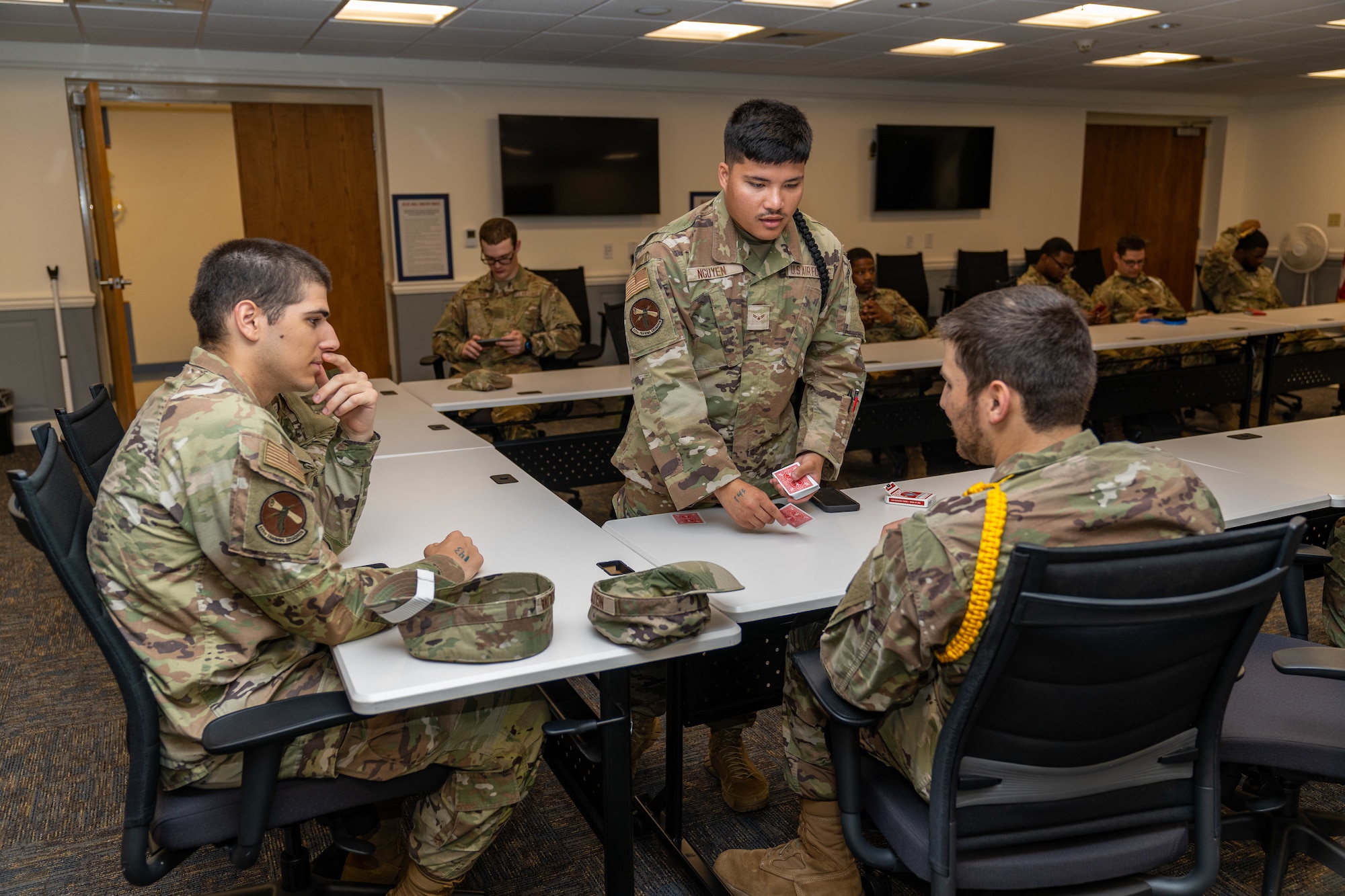 Students with the 335th Training Squadron play games at Allee Hall while sheltering during a hurricane exercise at Keesler Air Force Base, Mississippi, April 26, 2024. Keesler personnel participated in exercise scenarios in preparation for hurricane season. (U.S. Air Force photo by Andrew Young)