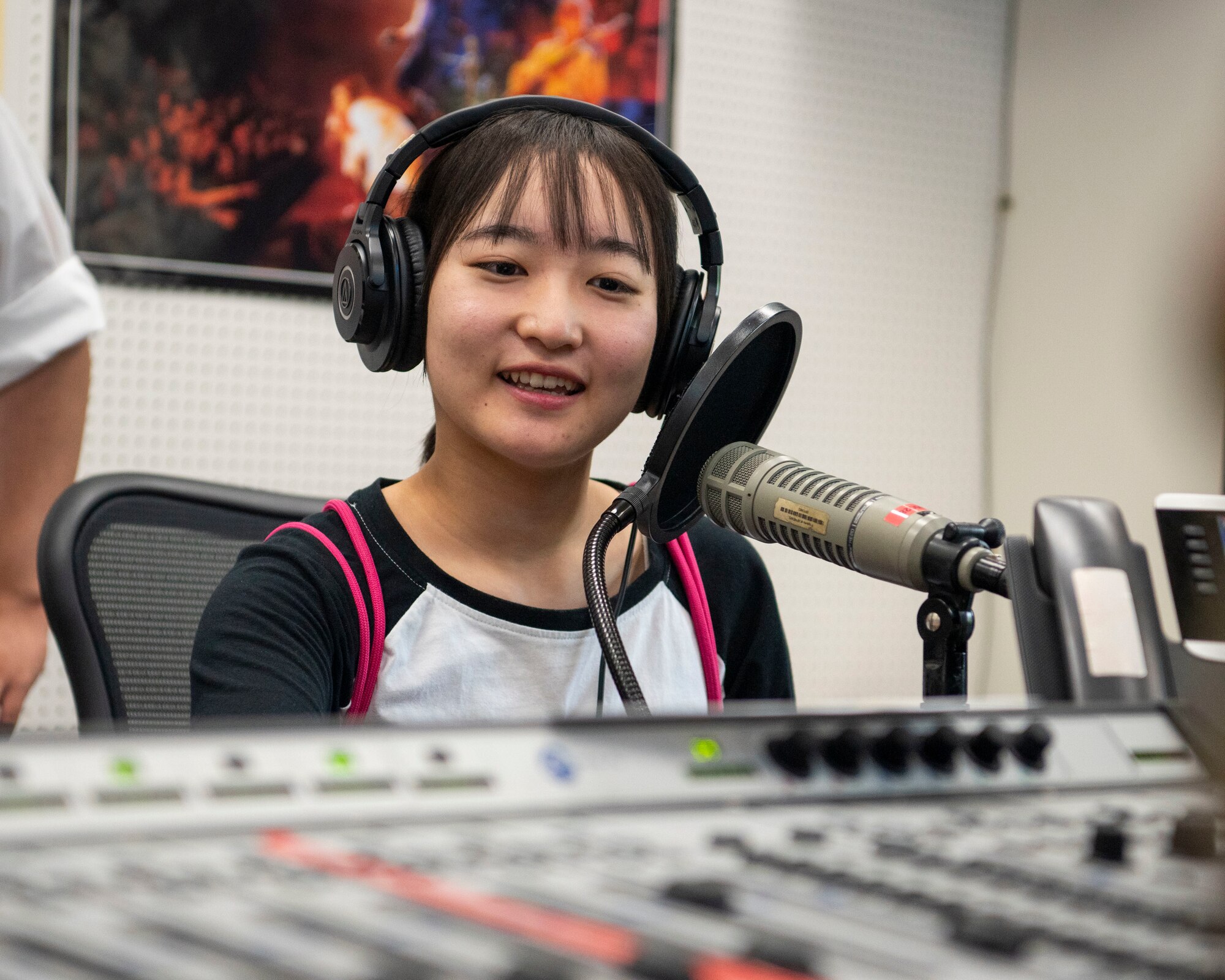 An Oirase Middle School student practices her English while learning about the American Forces Network radio equipment during a Junior English tour at Misawa Air Base, Japan, July 30, 2024.