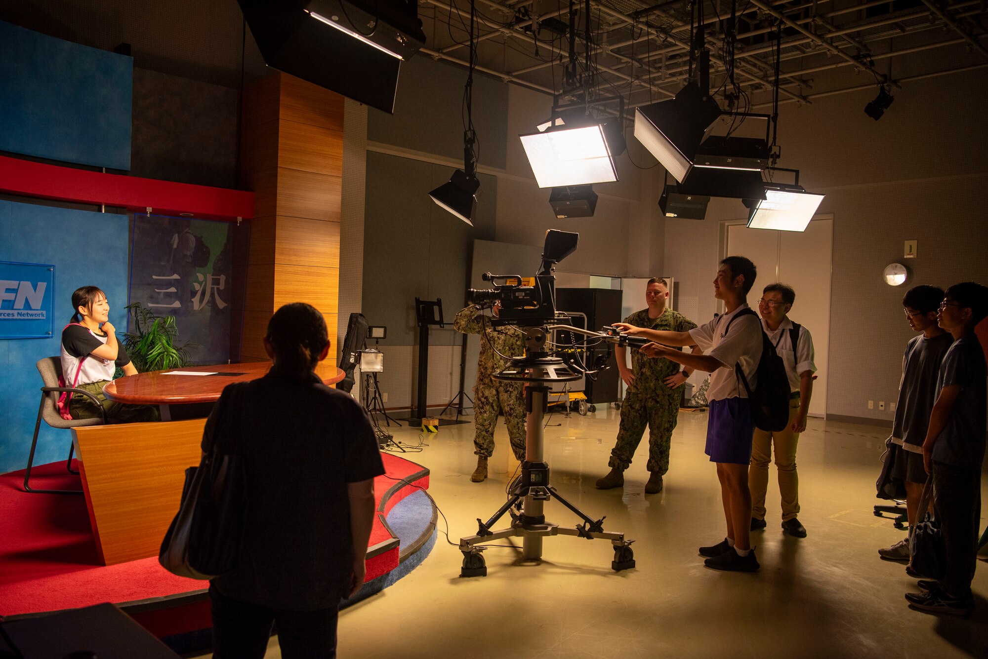Students from Oirase Middle School learn about the American Forces Network television studio during a Junior English tour at Misawa Air Base, Japan, July 30, 2024.