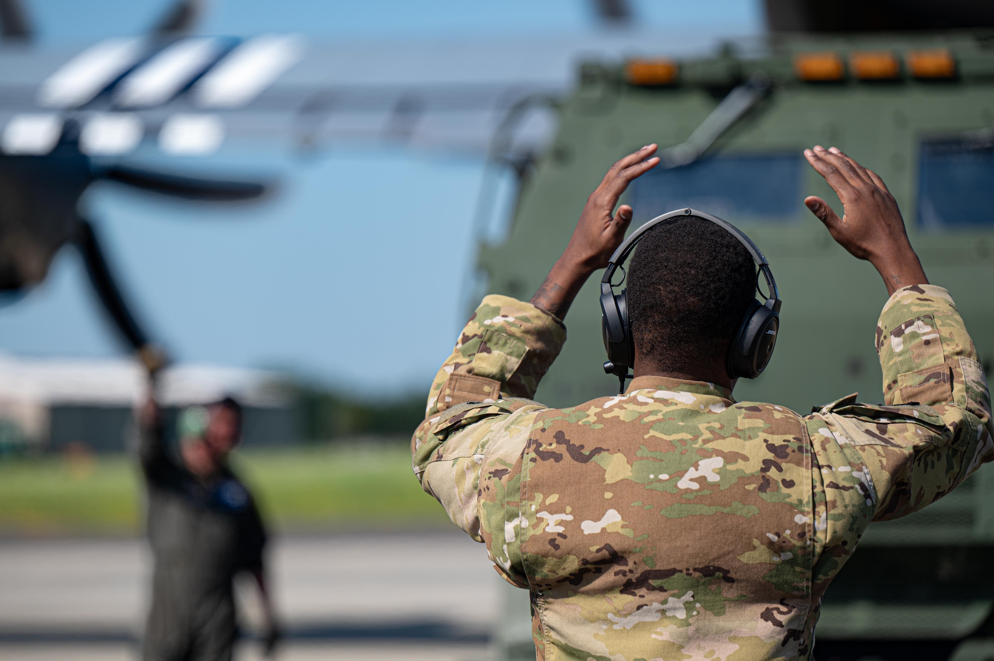 U.S. Air Force Airman 1st Class Zatavious Warren, 37th Airlift Squadron loadmaster, directs a U.S. Army National Guard M142 High Mobility Artillery Rocket System (HIMARS), from the 133rd Field Artillery Regiment, into a C-130J Super Hercules at Chievres Air Base, Belgium, July 29, 2024.