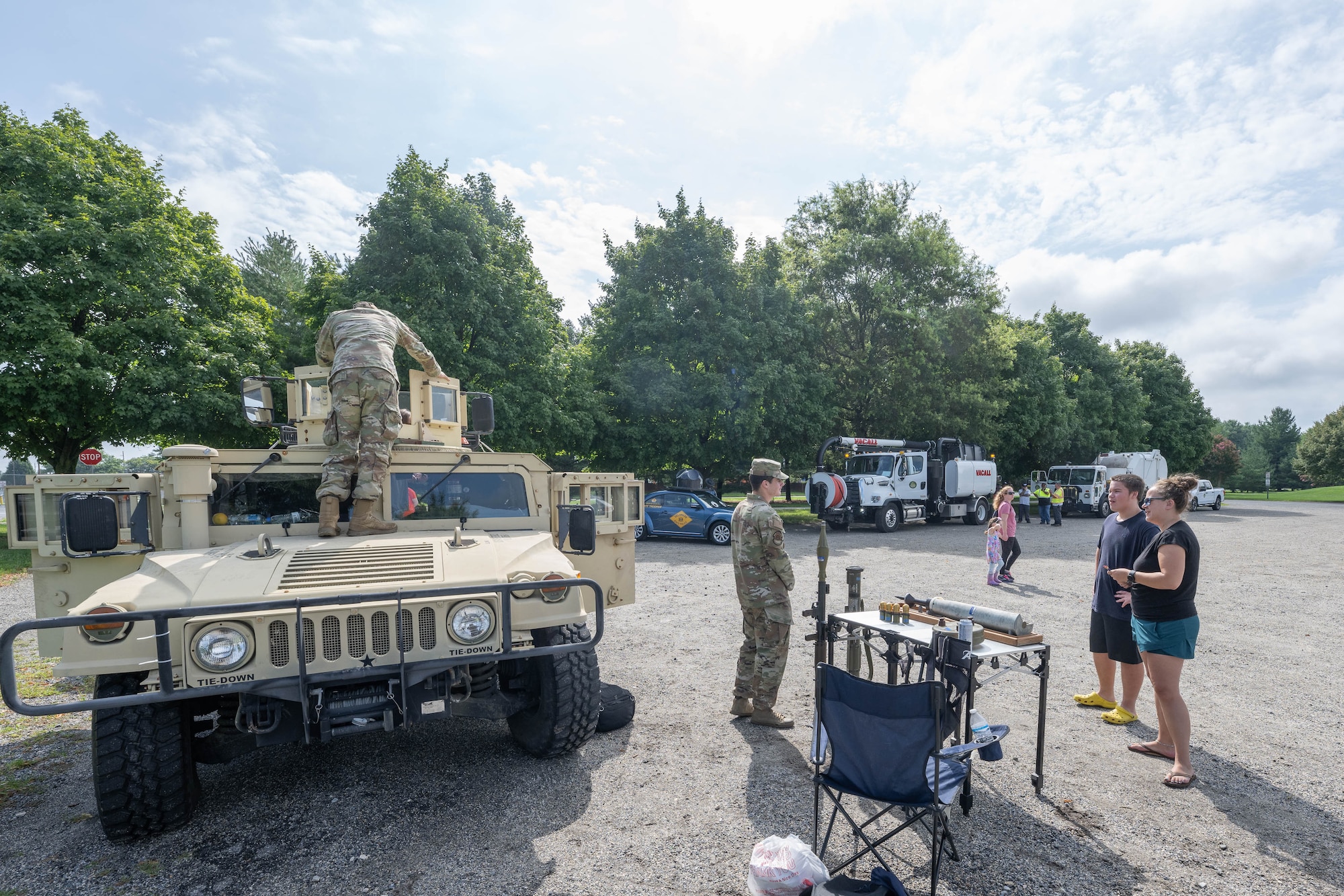 U.S. Airmen from the 436th Civil Engineer Squadron Explosive Ordnance Team talk with parents and children during a Touch a Truck event in Dover, Delaware, July 31, 2024. This year’s event featured nine different work vehicles including a fire truck, a police cruiser and several other utility vehicles. (U.S. Air Force photo by Mauricio Campino)