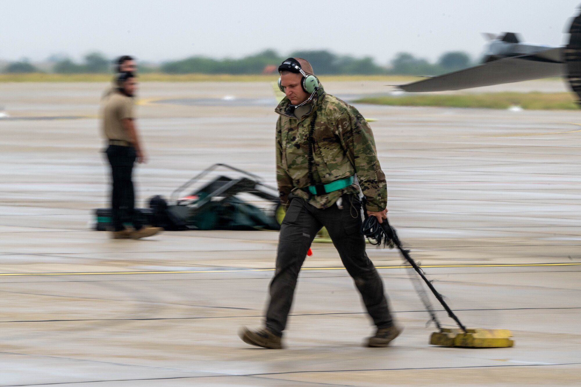 Crew chief assigned to the 555th Fighter Generation Squadron pulls chocks.