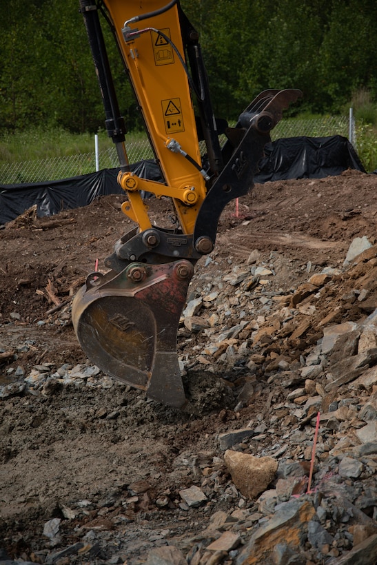 A U.S. Airman operates a crawler excavator to extract dirt during Innovative Training Readiness, Stonewall State Park, West Virginia, July 25, 2024. The mission of IRT is to produce mission-ready forces through military training opportunities that provide services for American communities. (U.S. Marine Corps photo by Lance Cpl. Kanoa Thomas)