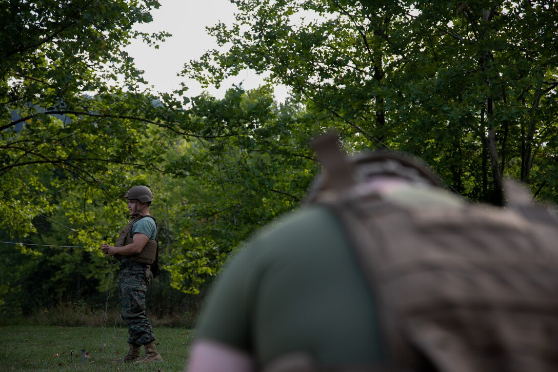 U.S. Marine Corps Sgt. Alberto M. Jurado, transmissions systems operator, Headquarters Company, 6th Communication Battalion, Force Headquarters Group, Marine Forces Reserve, disassembles a communication antenna used at Innovative Readiness Training project site, Stonewall State Park, West Virginia, July 26, 2024. The mission of IRT is to produce mission-ready forces through military training opportunities that provide services for American communities. (U.S. Marine Corps photo by Lance Cpl. Kanoa Thomas)