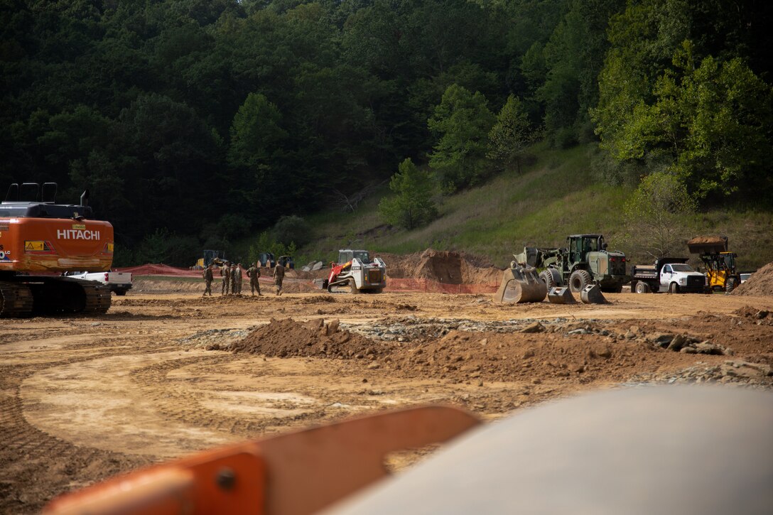 U.S. Marines with Landing Support Company, Combat Logistics Regiment 45, 4th Marine Logistics Group, Marine Forces Reserve, operate excavation equipment during Innovative Readiness Training, Stonewall State Park, West Virginia, July 26, 2024. The mission of IRT is to produce mission-ready forces through military training opportunities that provide services for American communities. (U.S. Marine Corps photo by Lance Cpl. Kanoa Thomas)
