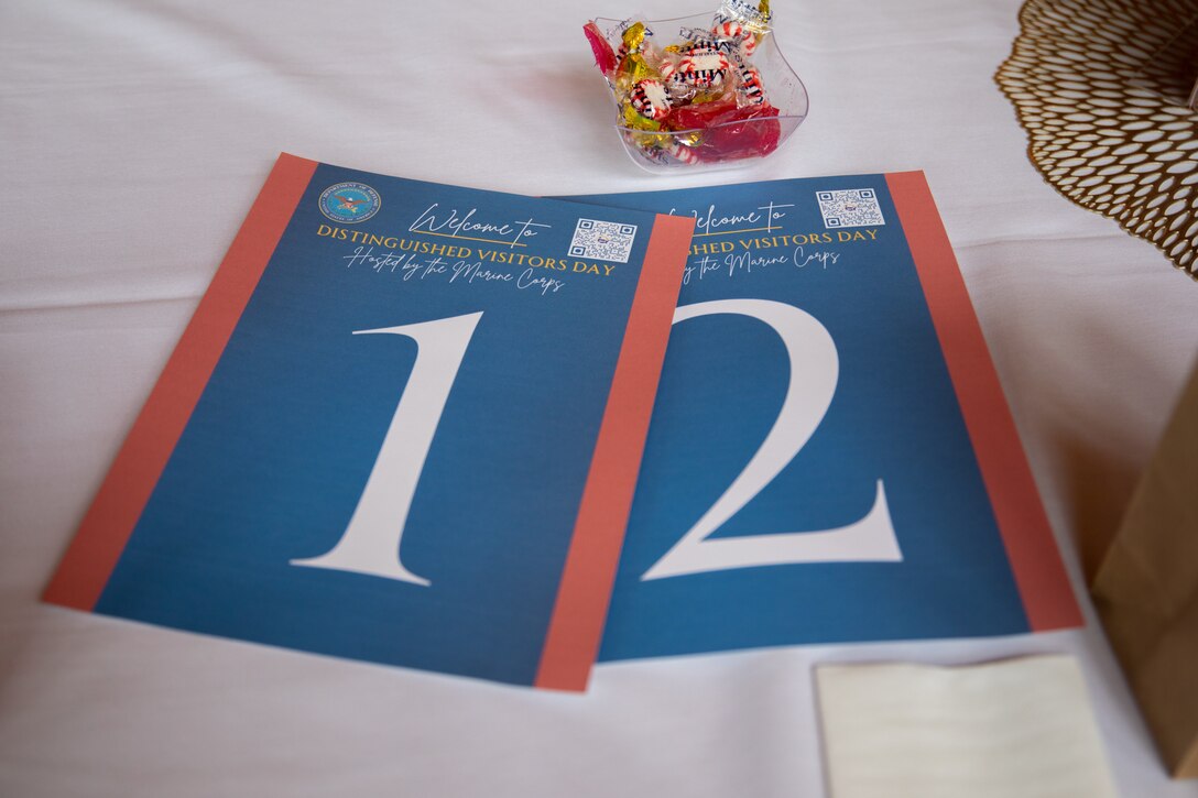 Welcoming flyers for distinguished visitors are set on a table for guests during Innovative Readiness Training, Stonewall State Park, West Virginia, July 25, 2024. The mission of IRT is to produce mission-ready forces through military training opportunities that provide services for American communities. (U.S. Marine Corps photo by Lance Cpl. Kanoa Thomas)