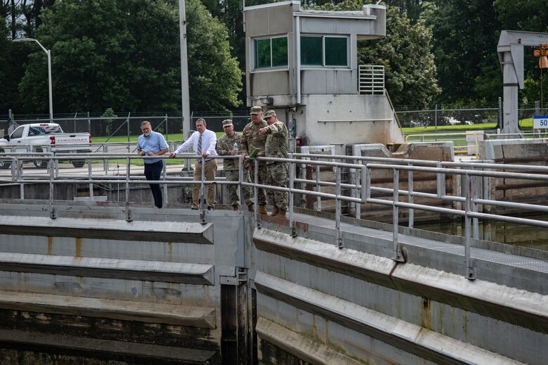 Lt. Col. Robert Green, right, commander of the U.S. Army Corps of Engineers Nashville District, points out features of Cheatham Lock and Dam to Maj. Gen Warner Ross II, adjutant general of the Tennessee National Guard, alongside other Guard and USACE personnel in Ashland City, Tennessee, July 29, 2024. (USACE Photo by Jeremy Croft)