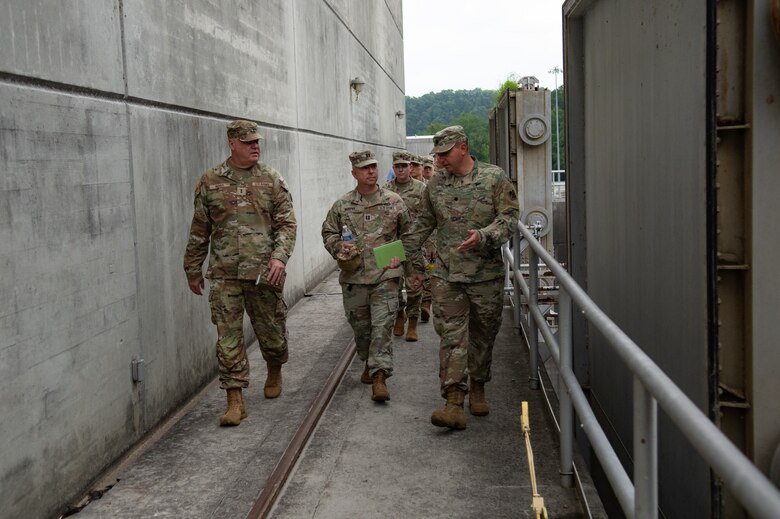 Lt. Col. Robert Green, commander of the U.S. Army Corps of Engineers Nashville District, right, discusses USACE capabilities with Maj. Gen. Warner Ross II, adjutant general of the Tennessee National Guard, by the hydropower plant at Cheatham Lock and Dam in Ashland City, Tennessee, July 29, 2024. (USACE Photo by Jeremy Croft)