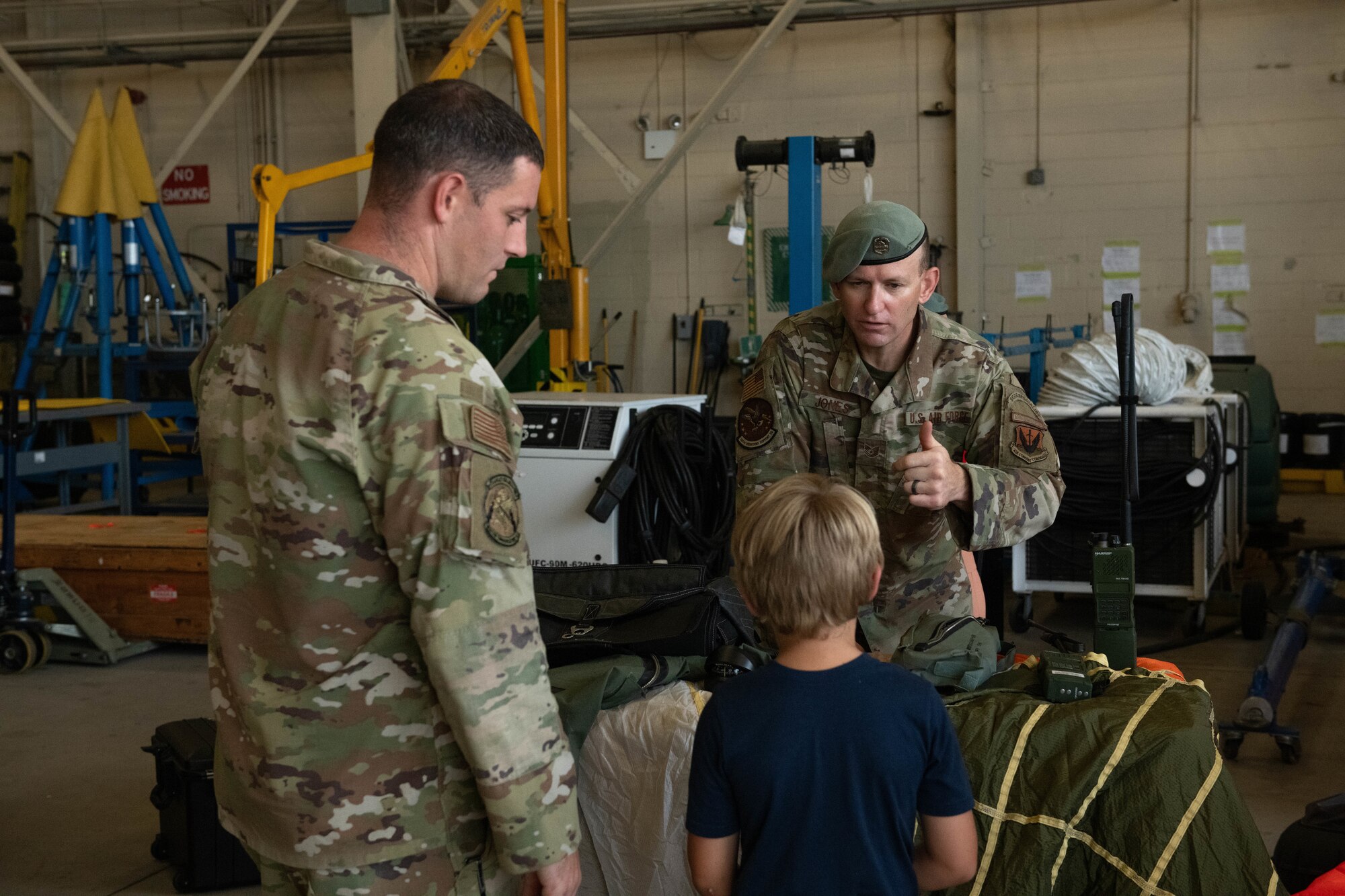 An airman talks to a child