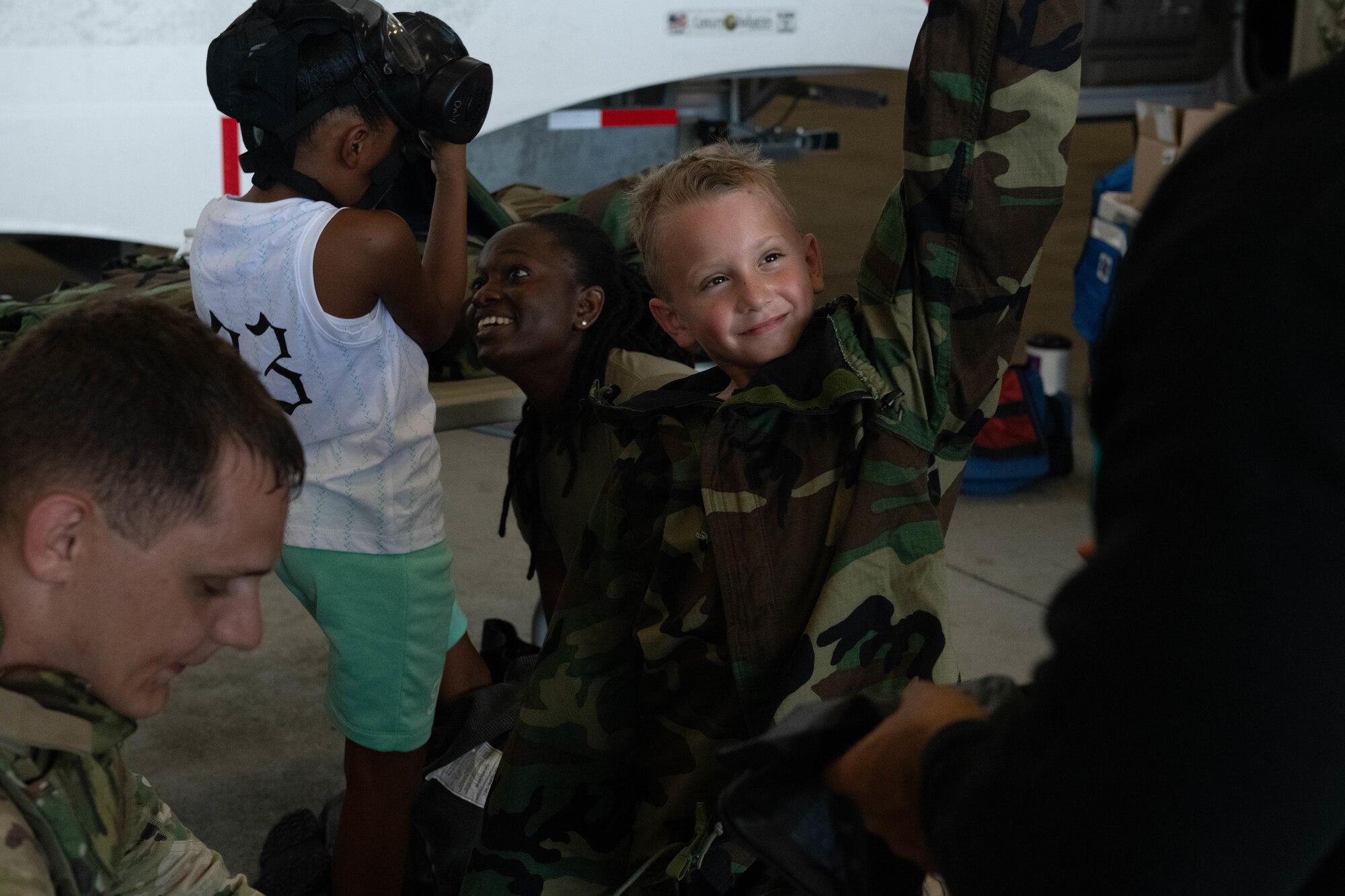 A child dressed in mission oriented protective posture gear