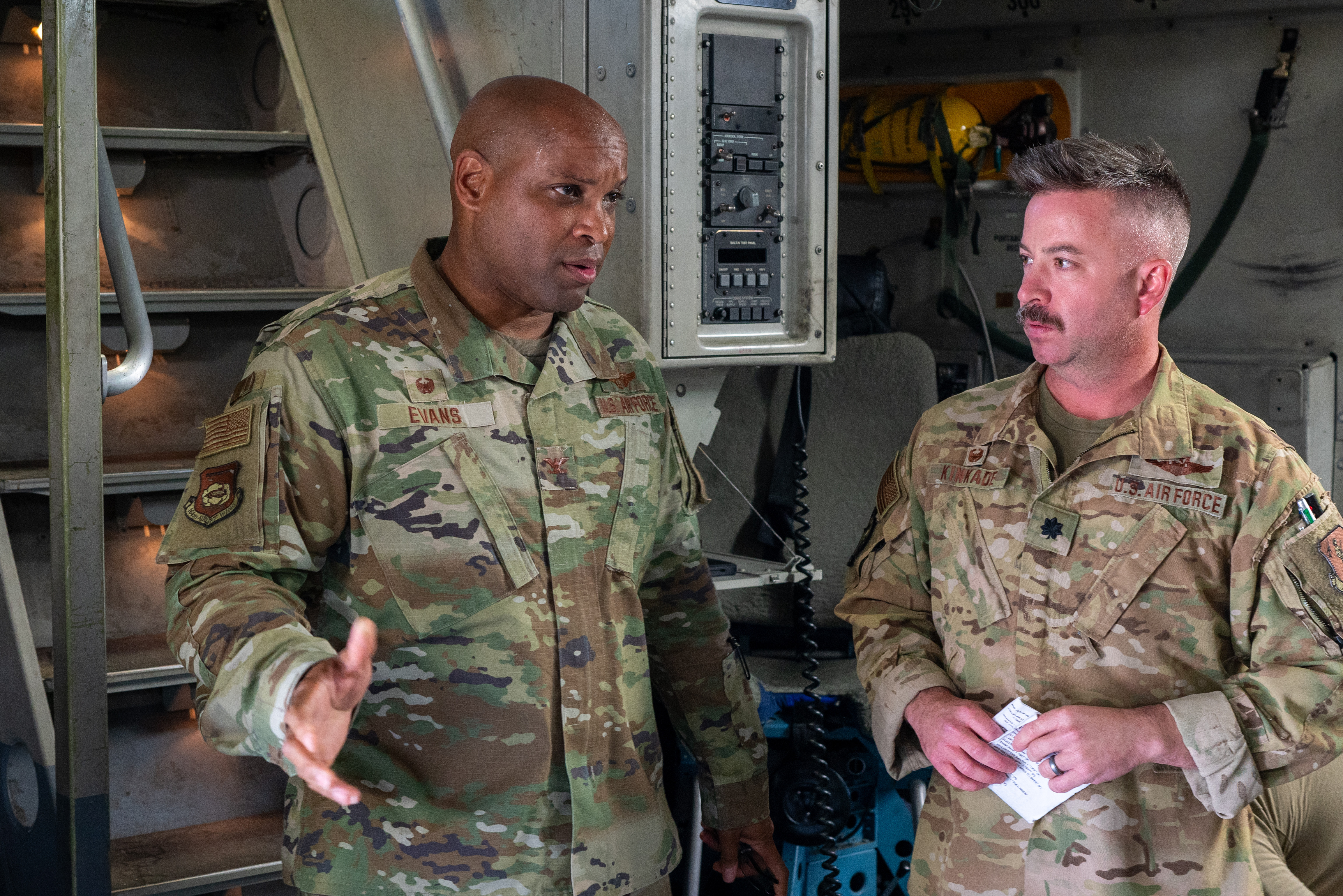 Col. Brandon C. Evans, wing commander, 164th Airlift Wing, talks with Col Craig Kinkade, commander, 155th Airlift Squadron, at the Memphis Air National Guard Base, June 28, 2024. Kinkade has come home after being deployed for three months.