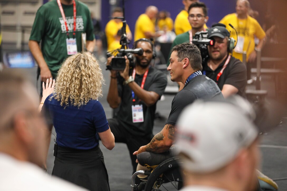U.S. Army veteran Jason Smith participates in an interview after the powerlifting competition during the 2024 Department of Defense Warrior Games