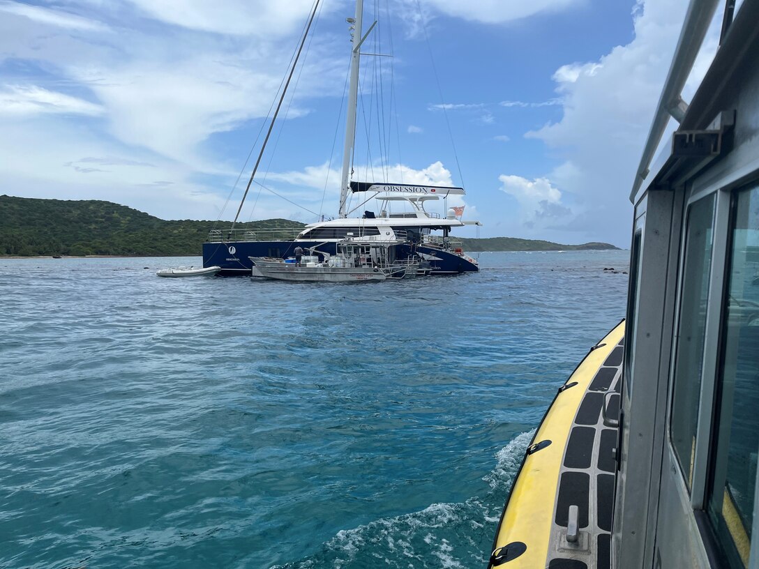 Photo showing fuel removal operations aboard the 72-foot sailing vessel Obsession hard aground on a reef just off Flamenco Beach in Culebra, Puerto Rico, July 31, 2024.  The Coast Guard established and Incident Command with local and federal interagency partners, July 26, 2024, to oversee the removal of an estimated 800 to 1,500 gallons of diesel from the vessel as well as the engine oil and any potential hazardous materials onboard. (Courtesy photo)