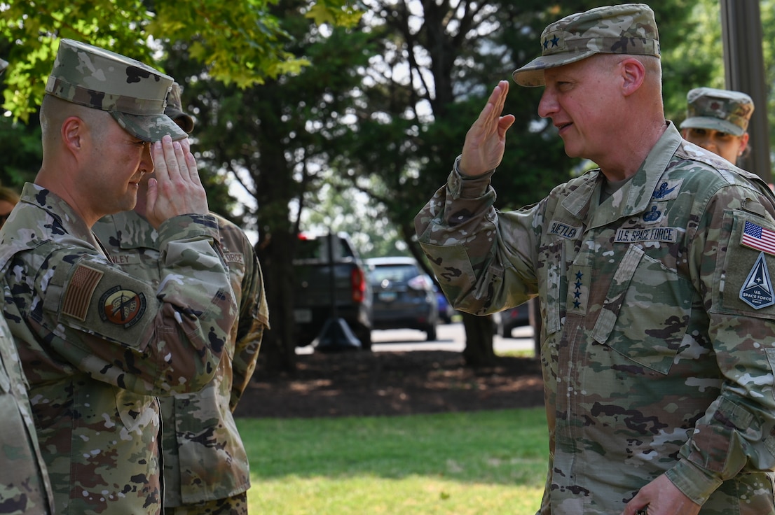 USAF Honor Guard commander salutes USSF VCSO