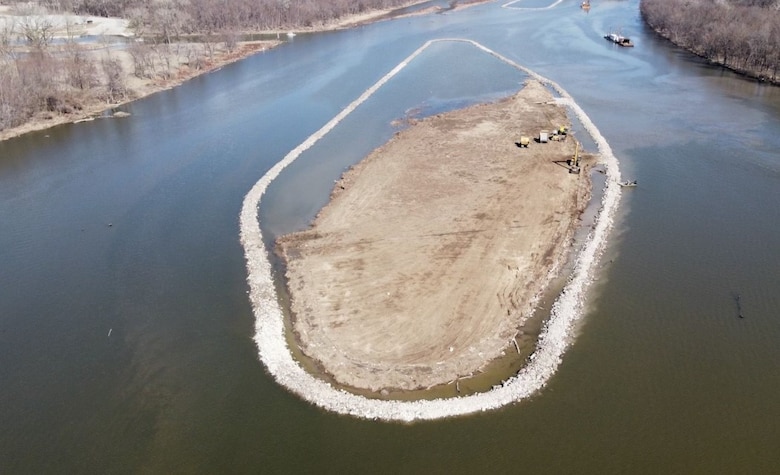 Aerial view of island building on the Mississippi River. The U.S. Army Corps of Engineers’ Upper Mississippi River Restoration Program placed more than 200,000 tons of rock to create island containment rings and a closing structure between Piasa and Eagles Nest Islands. The rings were filled with dredge material to create the island habitats located approximately eight miles upriver from Alton, IL, between Upper Mississippi River miles 208 and 210.  The project begin in 2021 and scheduled for completion in 2025.