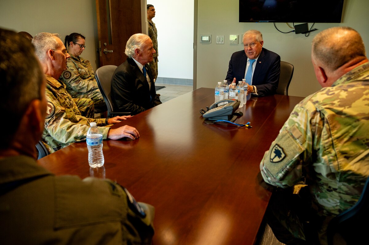 Secretary of the Air Force Frank Kendall, middle, met with South Carolina Governor Henry McMaster, left, and the Adjutant General of South Carolina Maj. Gen. R. Van McCarty, right, during a visit at McEntire Joint National Guard Base, South Carolina, July 31, 2024. The meeting provided an opportunity for high-level discussions on the unit’s recent achievements, including their deployment using the Expeditionary Air Base (XAB) model, and the broader implications for state and national defense strategies. This engagement underscored the collaborative efforts between state and federal leadership in supporting and enhancing the capabilities of the Air National Guard. (U.S. Air National Guard photo by Master. Sgt. Megan Floyd)