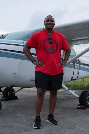 Man standing next to airplane