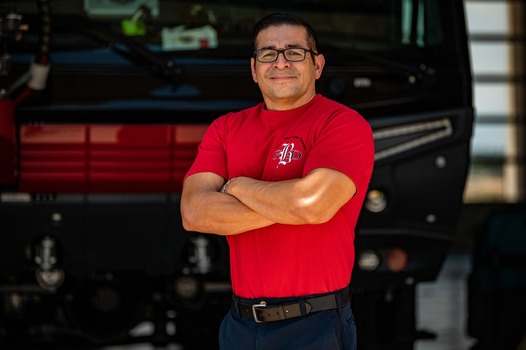 Man poses for photo in firefighter gear