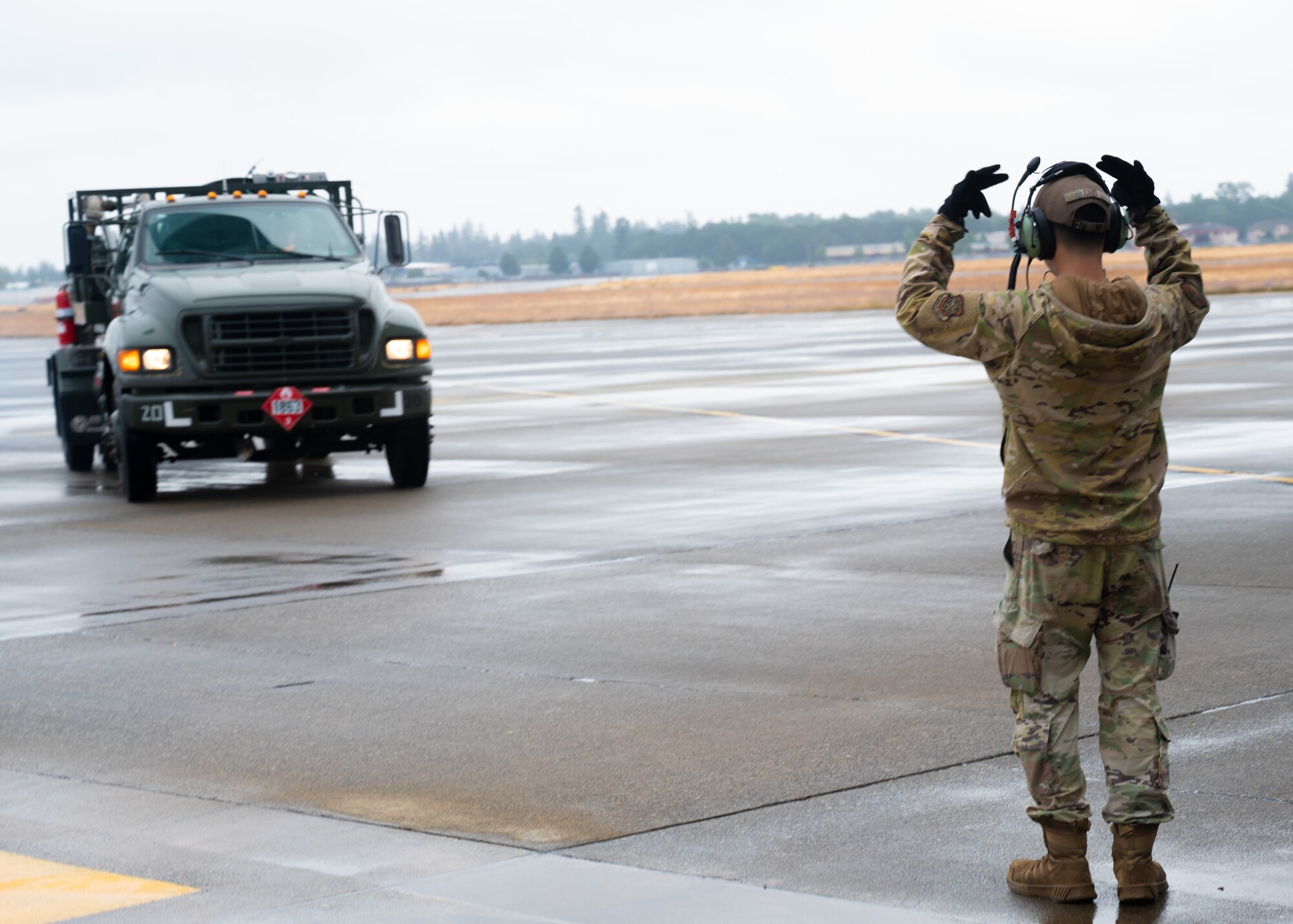 U.S. Air Force Airmen perform pre-flight checks at Joint Base Lewis-McChord, Washington, July 29, 2024. Crew chiefs from the 62d Aircraft Maintenance Squadron are responsible for many tasks including aircraft maintenance, inspections, repairs, and marshalling aircraft departing and arriving.