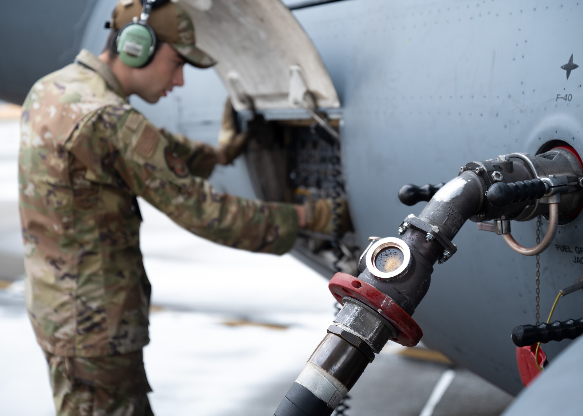 U.S. Air Force Airmen perform pre-flight checks at Joint Base Lewis-McChord, Washington, July 29, 2024. Crew chiefs from the 62d Aircraft Maintenance Squadron are responsible for many tasks including aircraft maintenance, inspections, repairs, and marshalling aircraft departing and arriving.