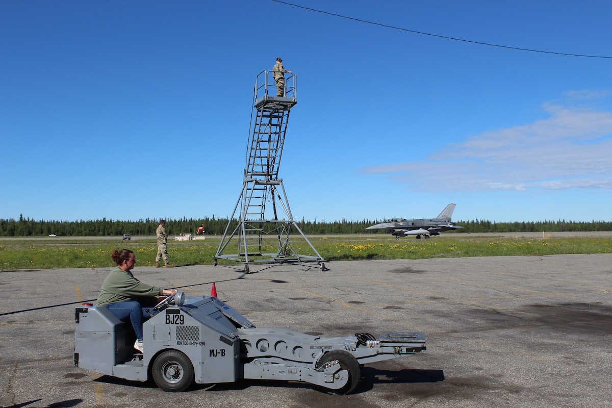 Spouses of the 354th Maintenance Squadron drive bomb lifts during a Mighty Moose Spouse’s Tour at Eielson Air Force Base, Alaska, June 7, 2024. The tour was designed to allow maintainer spouses to see a snapshot of what the 354th MXS team does on a day to day basis.