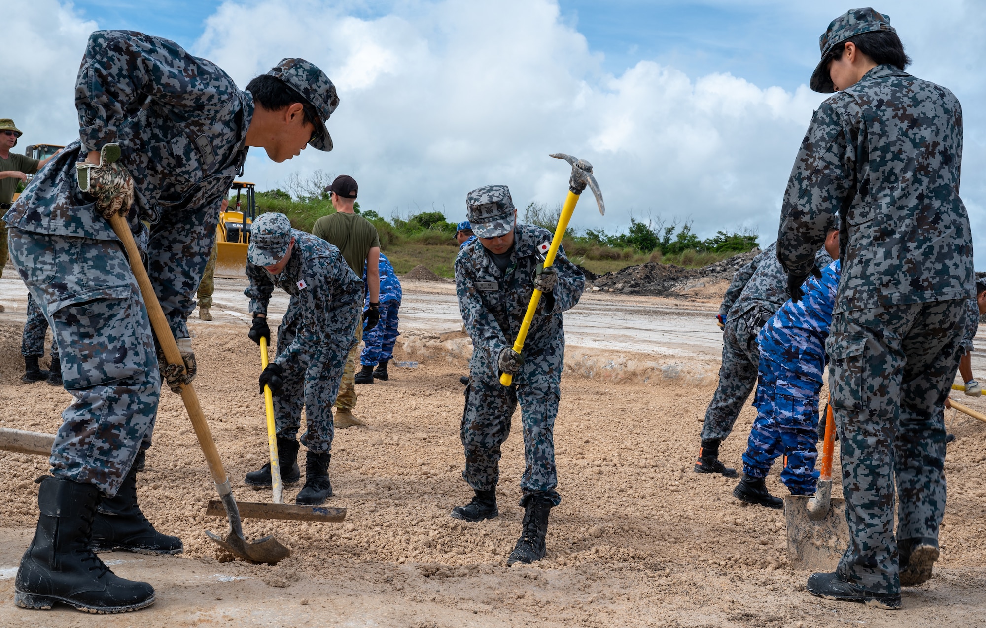 Japan Air Self-Defense Force members participate in a joint, multilateral rapid airfield damage repair training as a part of the Silver Flag exercise, at the Pacific Regional Training Center-Andersen, Guam, July 25, 2024.  The goal of the annual exercise is to enhance partnerships, promote regional stability and increase engineer interoperability. (U.S. Air Force Photo by Airman 1st Class Manasseh Demissie)