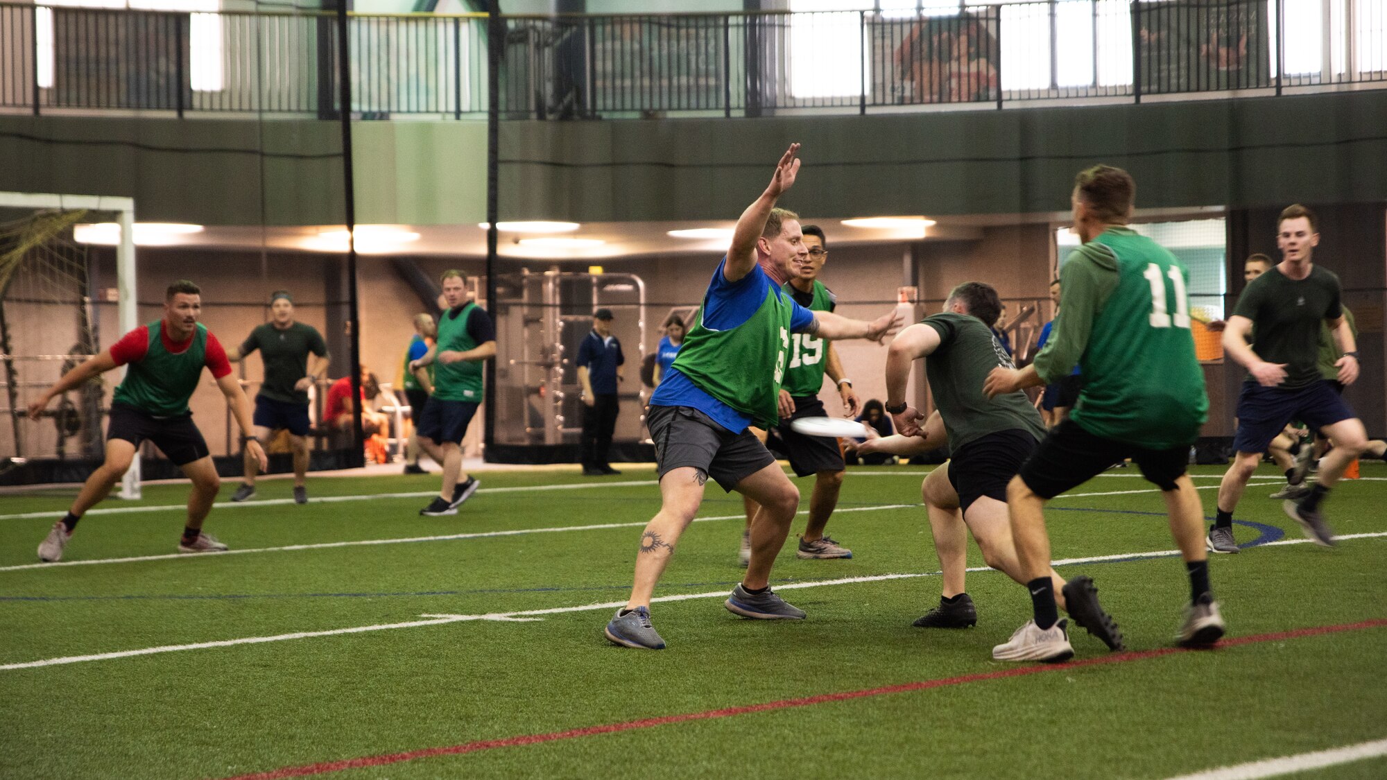 Members of the 356th Fighter Squadron and 354th Wing Staff Agencies compete in ultimate frisbee during Icemen Sports Day