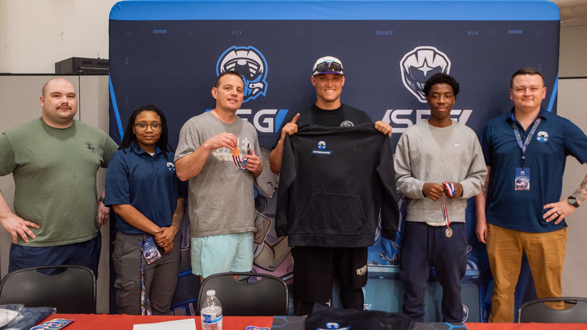 Winners of an Air Force Gaming tournament present their awards during Icemen Sports Day