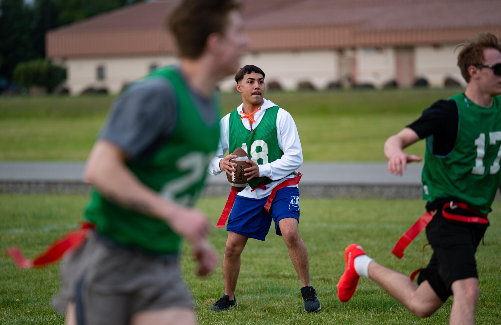 Airmen from the 354th Fighter Wing participate in a flag football competition during Icemen Sports Day